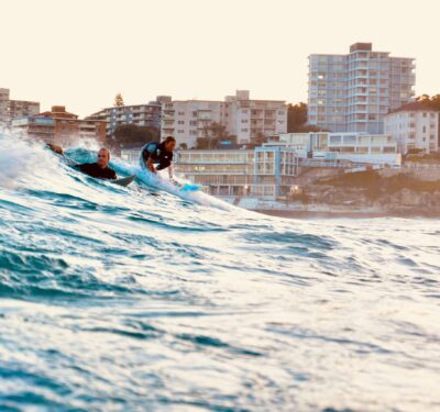 Happy Australians in the sea at the beach.